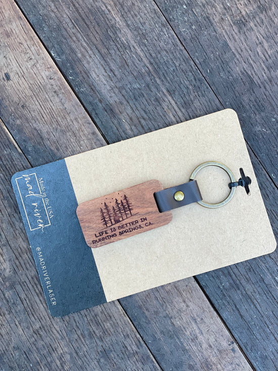 Load image into Gallery viewer, &amp;quot;Life is Better in Running Springs&amp;quot; Wood and Leather Keychain
